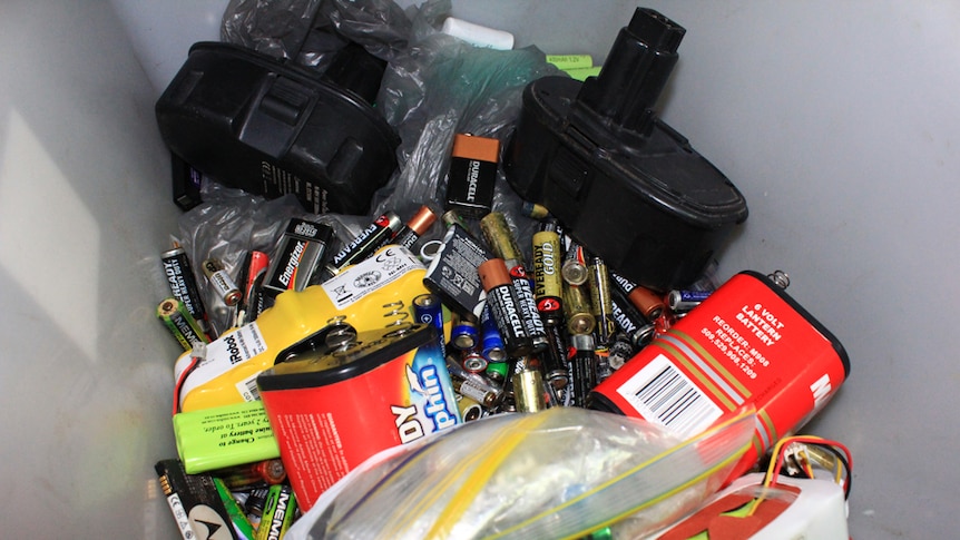 Different types of batteries in a recycling box