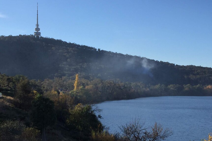 Smoke hovers over Black Mountain