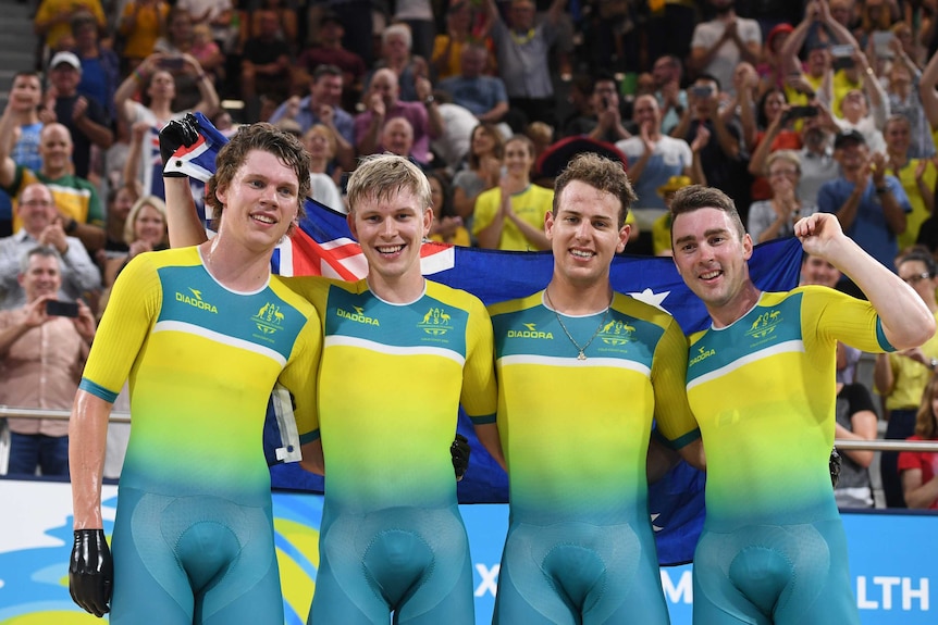 Men's pursuit team pose with Australian flag.