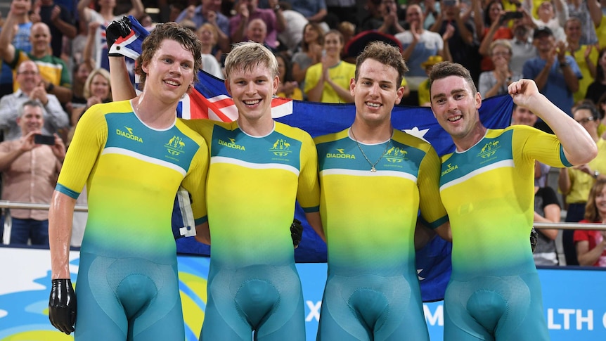 Men's pursuit team pose with Australian flag.