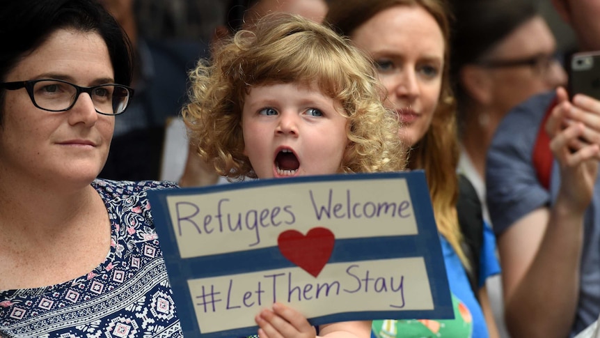 Young girl joined the pro-refugee protest