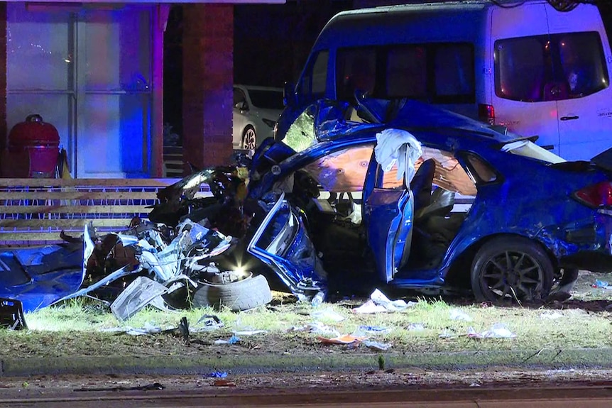 A blue car destroyed in a car crash