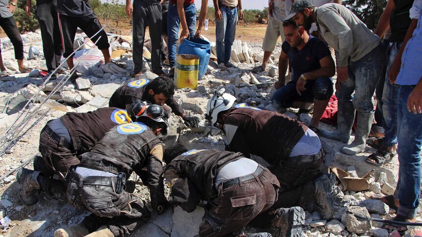 Civil dense workers searching in the rubble after airstrikes hit in the northern province of Idlib.