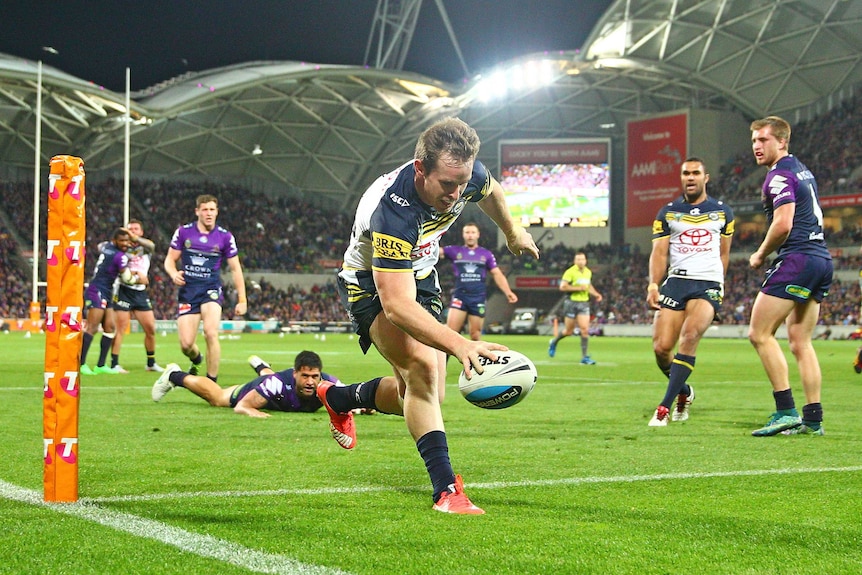Michael Morgan scores a try against the Melbourne Storm in their preliminary final