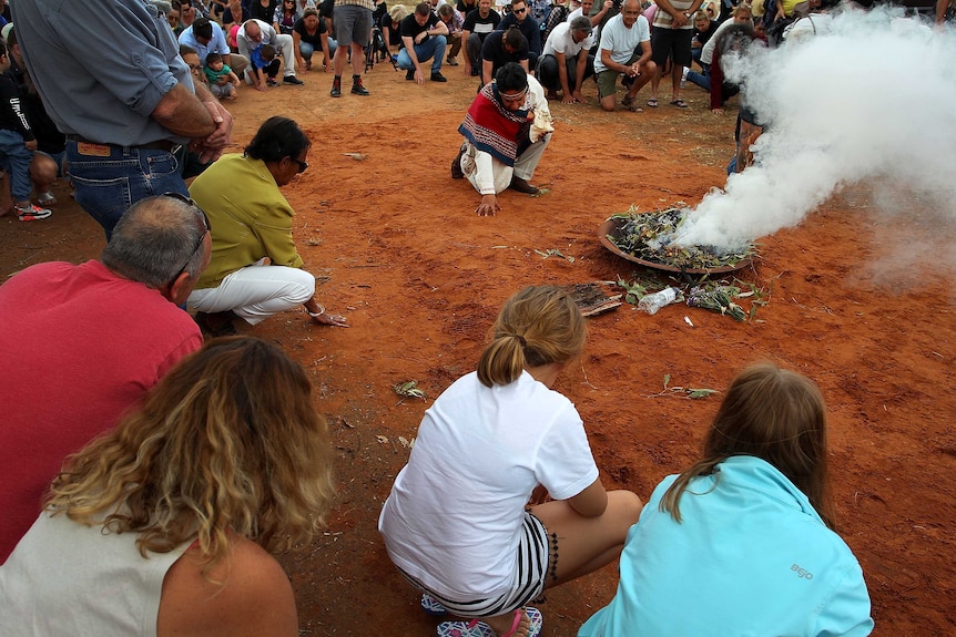 A smoking ceremony during the arrival of Mungo Man