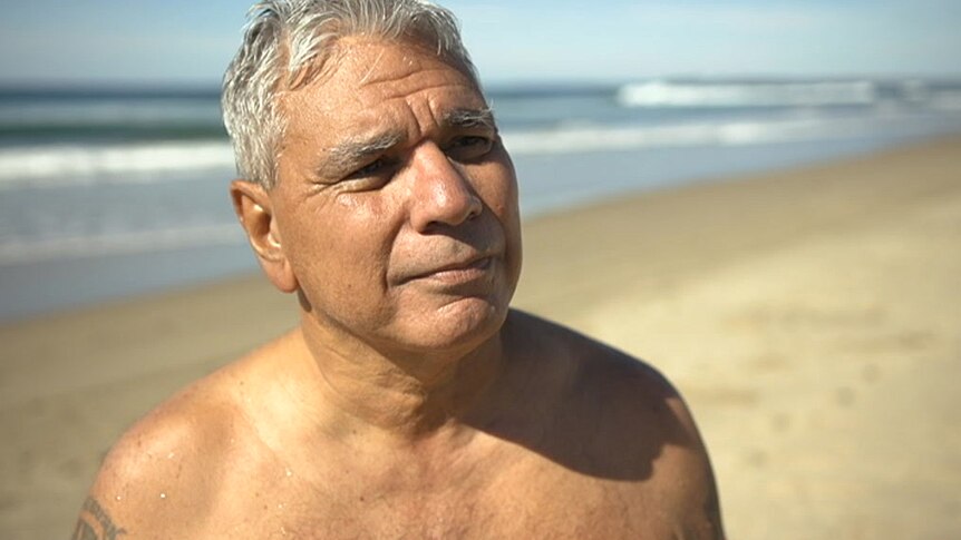 Warren Mundine shirtless at the beach