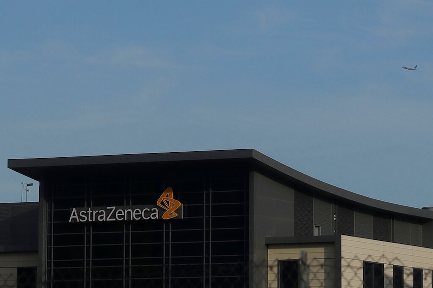 A view of the AstraZeneca logo, in black white and orange on a building, in South San Francisco.