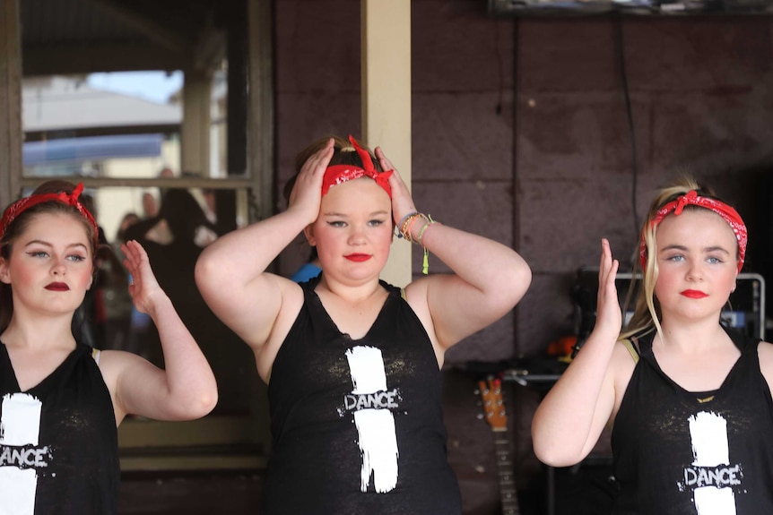 The girls of the town perform for locals