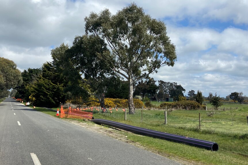 A photo of some piping on the side of the road