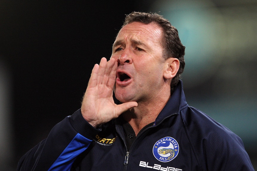 a coach calls out from the sidelines of an NRL match