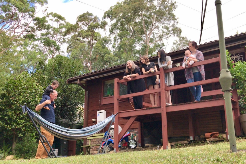 Taylor family in the back yard of their home