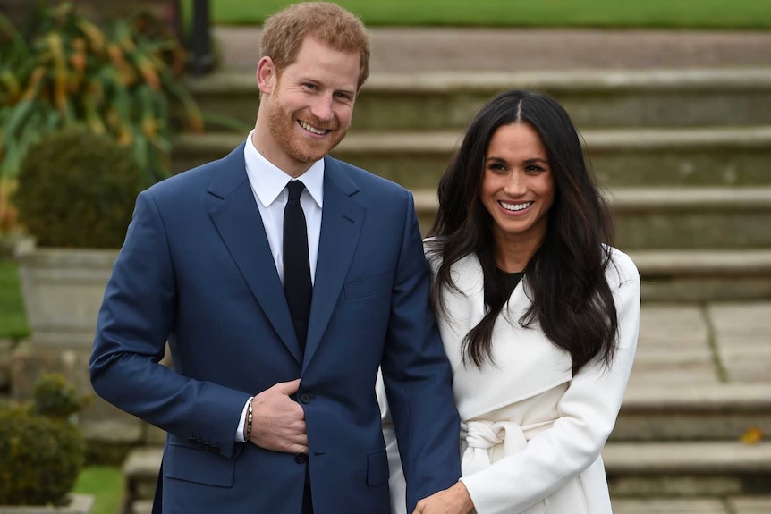 Britain's Prince Harry poses with Meghan Markle in the Sunken Garden of Kensington Palace, London, Britain, November 27, 2017.