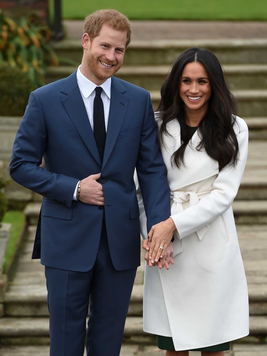 Britain's Prince Harry poses with Meghan Markle in the Sunken Garden of Kensington Palace, London, Britain, November 27, 2017.