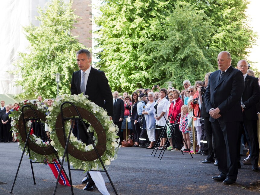 PM Jens Stoltenberg lays a reef during commemorations for the Utoya massacre and Norway bombing