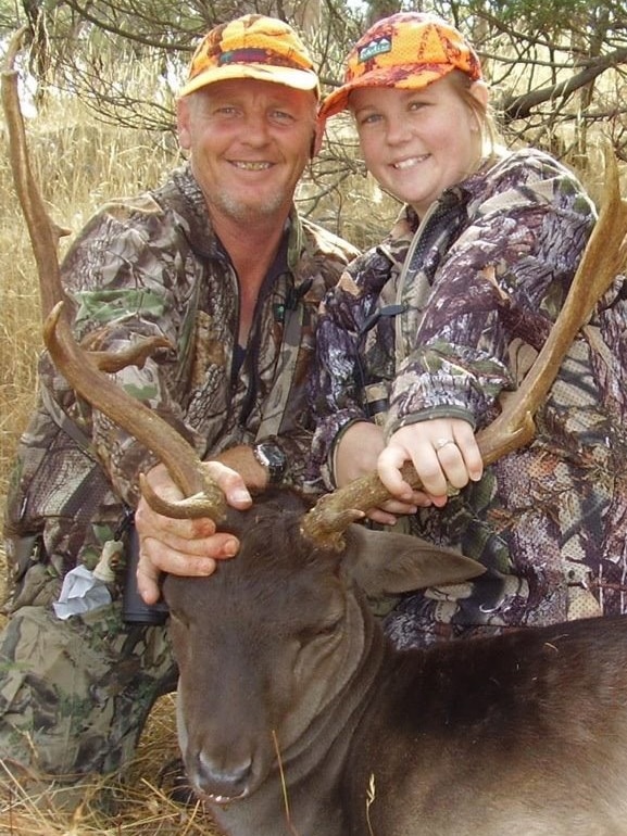 Natasha Holland and Mark Windwood with a stag in Tasmania's Midlands