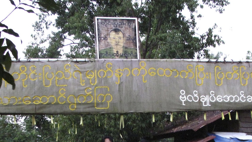 Call for unity: Aung San Suu Kyi greets supporters outside her home