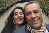 A selfie of Ayman and Samiha, both smiling warmly, a park pathway visible behind them.