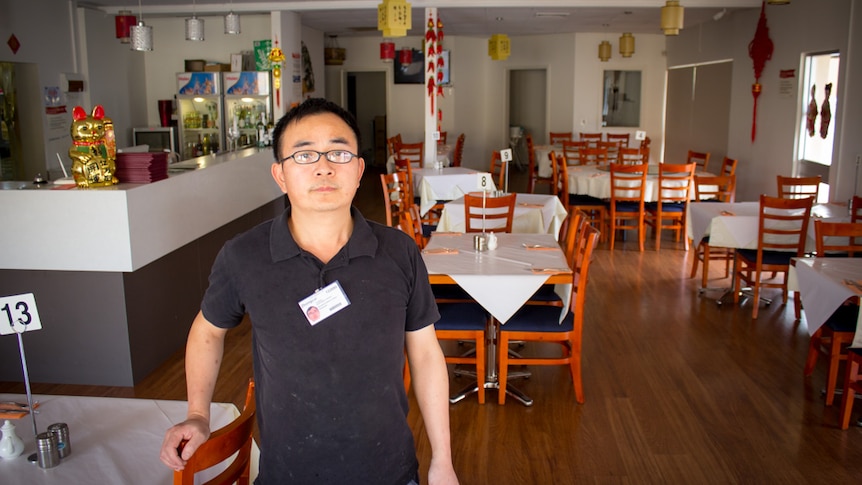 Zhongcui Fan in his restaurant.