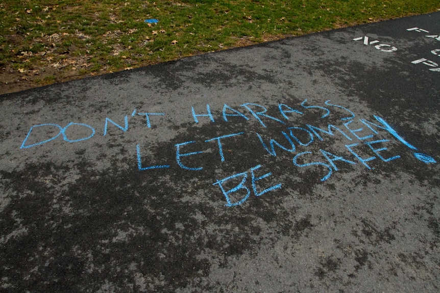 Anti-street harassment messages in chalk