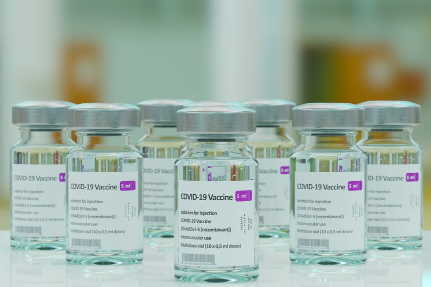 Small glass vials of AstraZeneca's COVID-19 vaccine.
