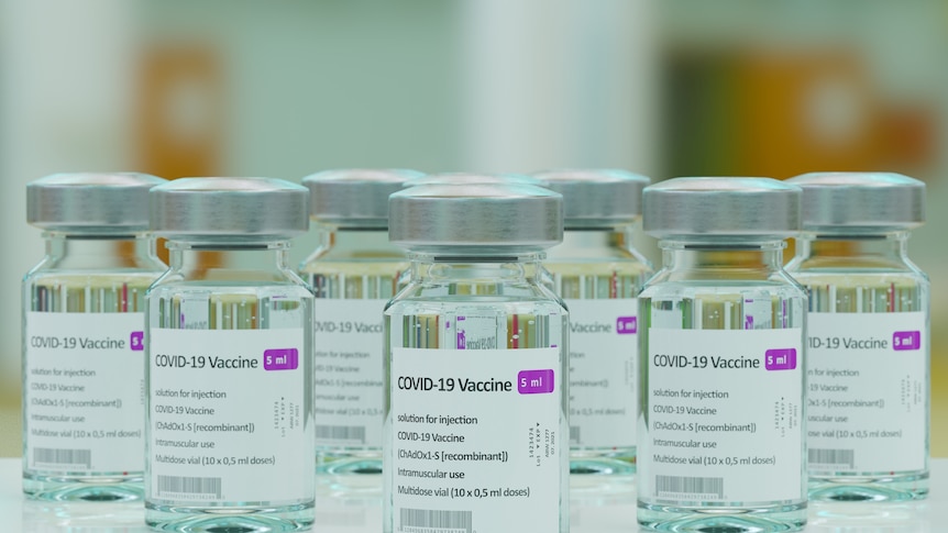 Small glass vials of AstraZeneca's COVID-19 vaccine.