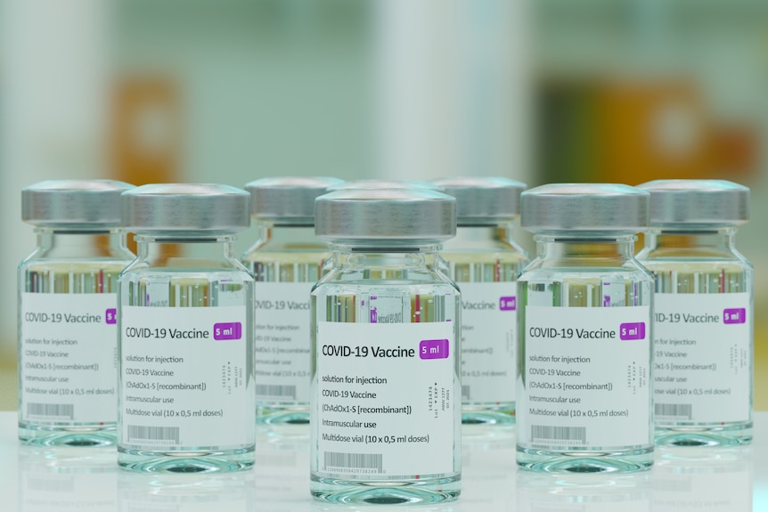 Small glass vials of AstraZeneca's COVID-19 vaccine.