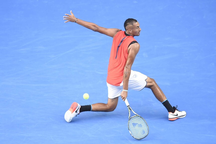 Nick Kyrgios backhands at the Australian Open