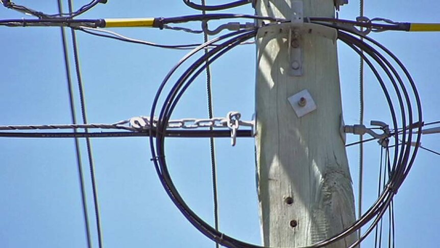 Fibre optic cables on a power pole in Tasmania during the NBN rollout.