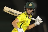 Australia batter Meg Lanning starts running with her bat over her shoulder during a T20 World Cup match.