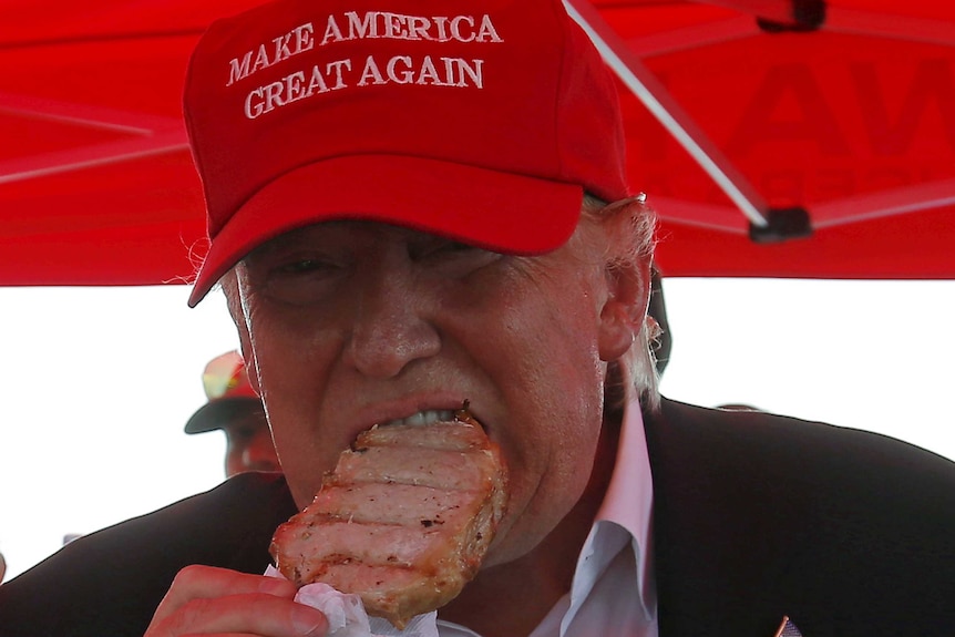 Donald Trump eats a pork chop at the Iowa State Fair.