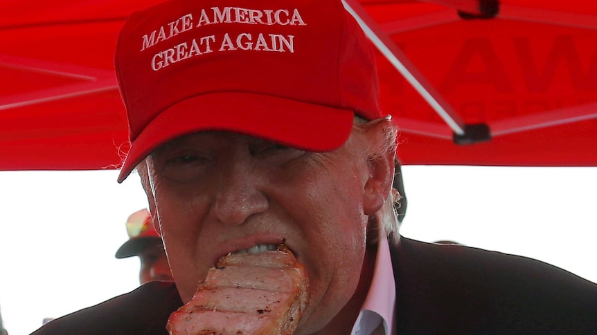 Donald Trump eats a pork chop at the Iowa State Fair in 2015