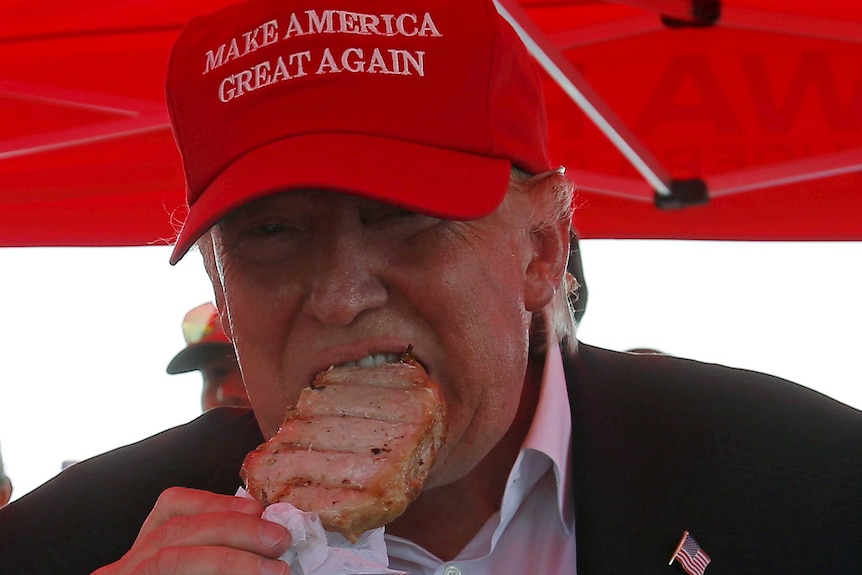 Donald Trump eats a pork chop at the Iowa State Fair in 2015