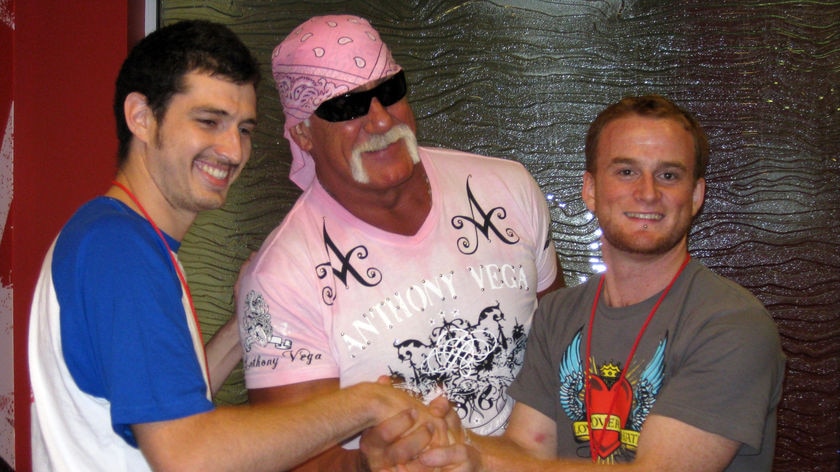 Handshakers Jack Tsonis (L) and Lindsay Morrison with WWF star Hulk Hogan