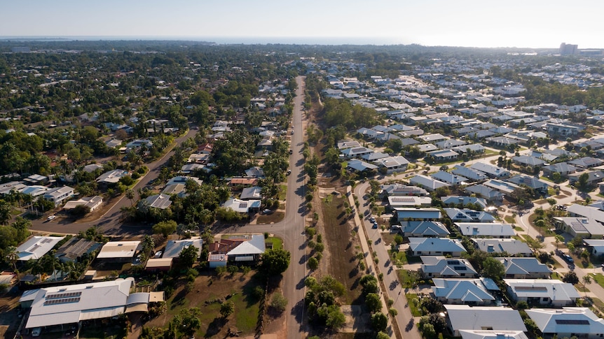 An aerial shot of a leafy Darwin suburb stretching out to the horizon
