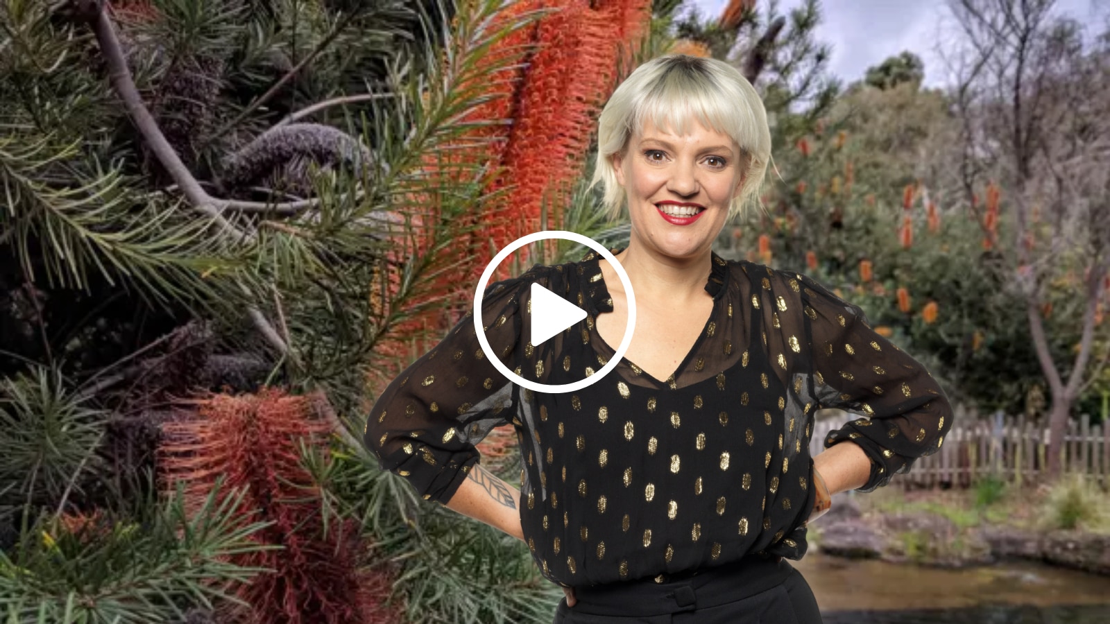 a woman in black against a garden background