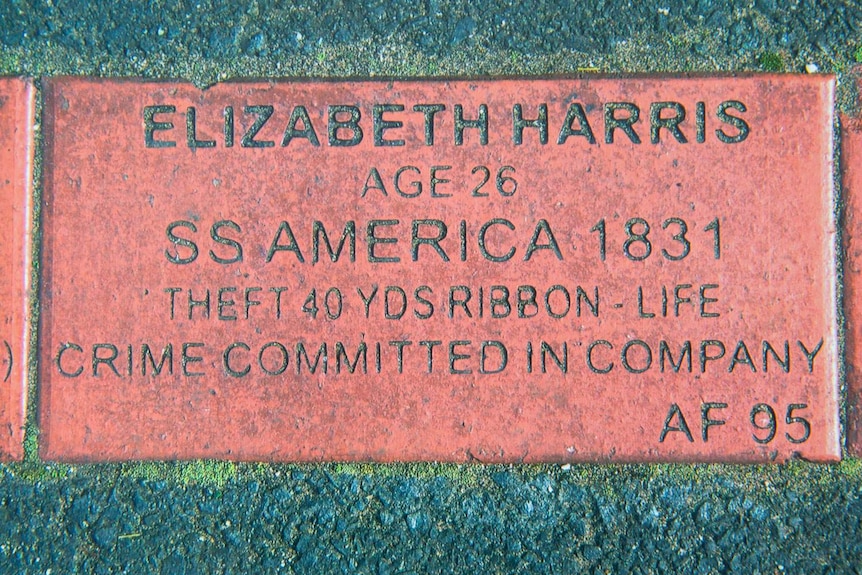 Paver embedded in asphalt recording the convict transportation details of Elizabeth Harris