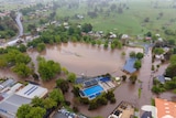 An aerial view of a flooded oval.
