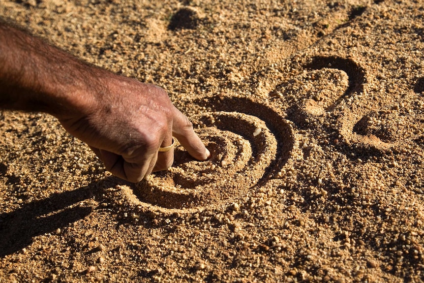 Sand painting in the desert