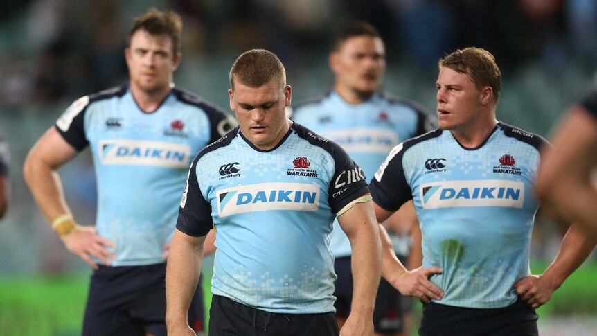 The Waratahs leave the field after their shock loss to the Kings in Sydney.
