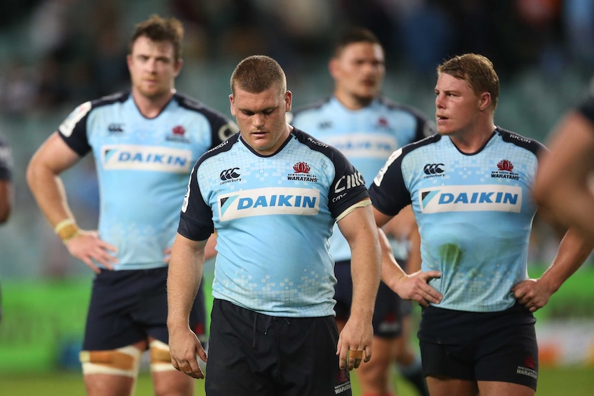 The Waratahs leave the field after their shock loss to the Kings in Sydney.