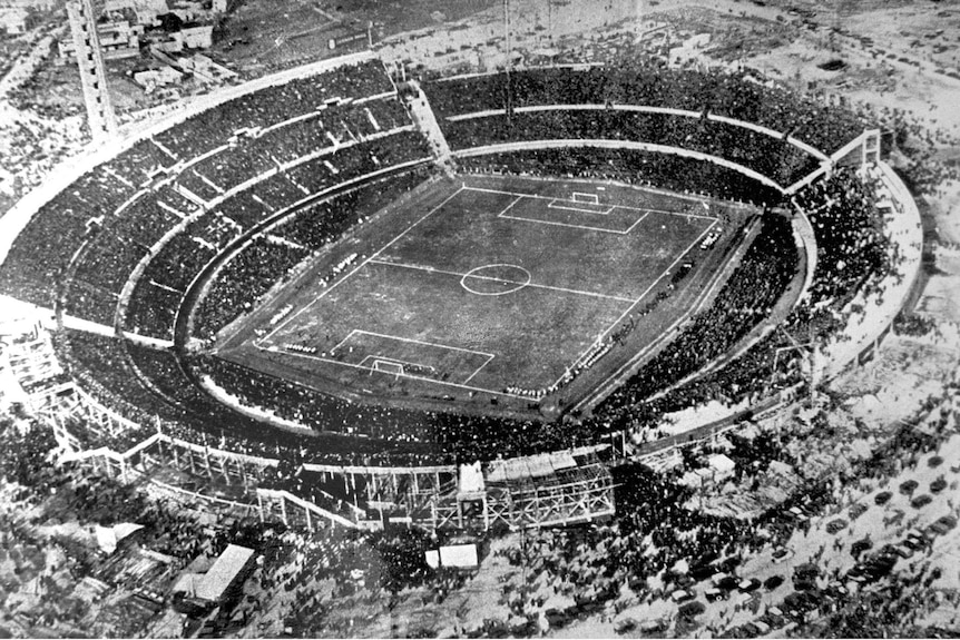 An aerial shot in black and white of the Centenario stadium in Montevideo