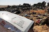 The remains of a Russian airliner are inspected in Egypt's Sinai.