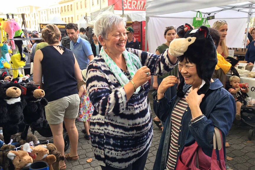 Jillian Hall and her Japanese pen pal of 55 years, Kumiko Maruyama, at Hobart's Salamanca market.