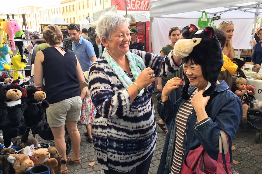 Jillian Hall and her Japanese pen pal of 55 years, Kumiko Maruyama, at Hobart's Salamanca market.
