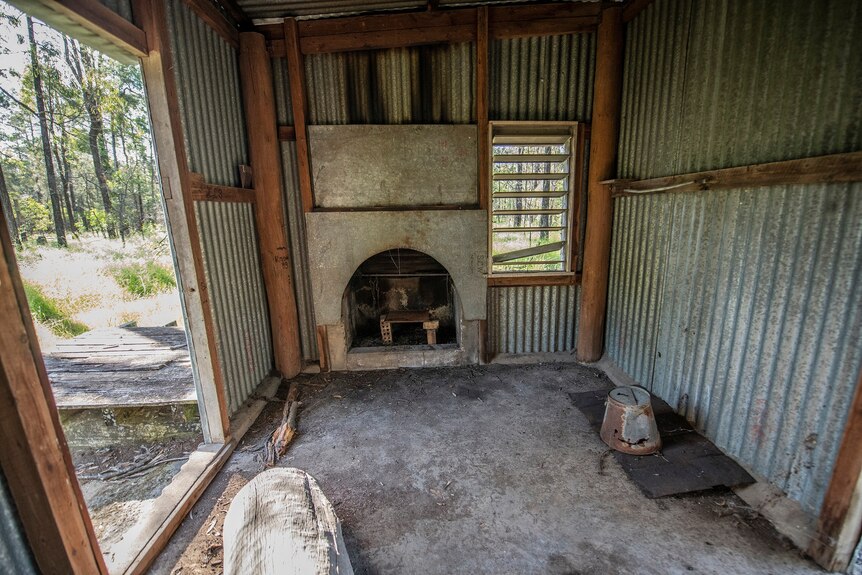 iron shack with stove inside fireplace