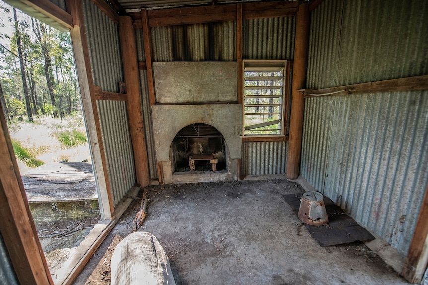 iron shack with stove inside fireplace