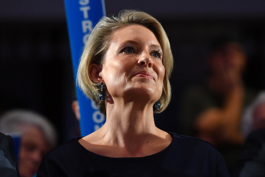 Katherine Deves sits at a Liberal Party rally 