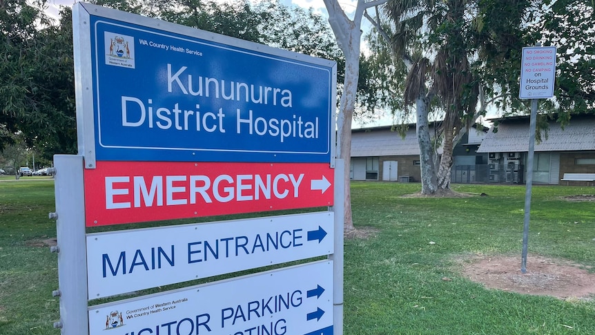 hospital sign in front of green lawn