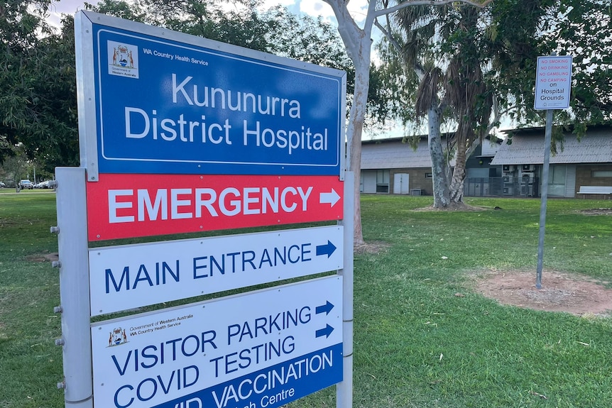 hospital sign in front of green lawn