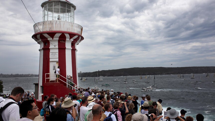 Spectators at South Head watch the start of the 67th Sydney to Hobart yacht race.